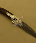 Damascus Steel Folding Knife With Rosewood Handle And Floral Brass Bolster, 4.5 Inch Overall Drop Point Blade, displayed open on a light surface