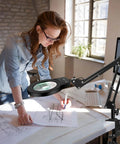 Woman using Go-To Desk Magnifier Lamp With Clamp Stand 10X-5X HD Loupe Hands Free Light for crafting and reading fine print