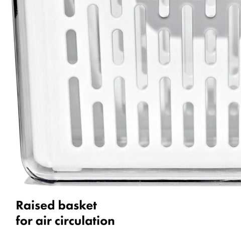 Close-up of medium white BPA-free organizer bin with raised basket for air circulation, ideal for fresh produce storage in fridge.