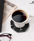 Slick Black Star Marble Coasters Set Of Six Natural Polished Stone Drink Guards For Coffee And Dining Tables with coffee mug.