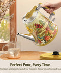 Retro 1L Electric Kettle Cordless 800W Fast Boil Double Wall 304 Stainless Steel BPA Free Auto Shut Off Compact One Cup Brew Buddy For Tea And Coffee Eduardo Recife Collaboration Edition, floral design, pouring water into a glass cup.
