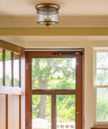 Rustic Gold 3-Light Flush Mount Ceiling Light With Clear Glass Shade, Antiqued Brass Finish in hallway interior
