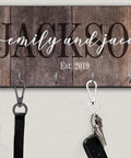 Heavy Duty Swivel Lobster Clasp Half Inch Zinc Alloy Hook For Purses Bags Lanyards Keys 12 Pack Gunmetal Black Finish Easy Twist Rotation Hardware For DIY Projects Built Solid And Straight Up Tough with keys attached to a wooden key holder.