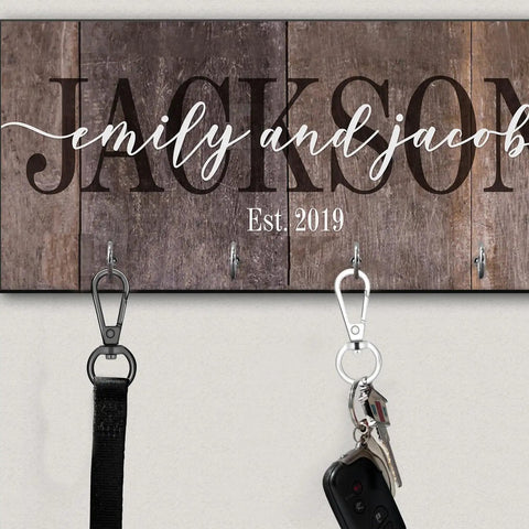 Heavy Duty Swivel Lobster Clasp Half Inch Zinc Alloy Hook For Purses Bags Lanyards Keys 12 Pack Gunmetal Black Finish Easy Twist Rotation Hardware For DIY Projects Built Solid And Straight Up Tough with keys attached to a wooden key holder.