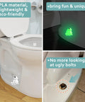 Frog Toilet Bolt Covers Glow In The Dark 2 Pack Luminous Green PLA Push On Screw Caps installed on toilet base, showing glow effect.