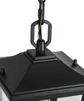 Straight Up Farmhouse Outdoor Pendant Light With Clear Glass Shade And Rust Proof Metal Frame Killing It As A Heavy Duty Hanging Lantern Top Shelf Pick For Porches Entryways And Gazebos In Sleek Matte Black close-up of the metal frame and chain.