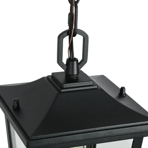 Straight Up Farmhouse Outdoor Pendant Light With Clear Glass Shade And Rust Proof Metal Frame Killing It As A Heavy Duty Hanging Lantern Top Shelf Pick For Porches Entryways And Gazebos In Sleek Matte Black close-up of the metal frame and chain.