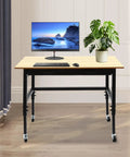 Heavy Duty Rolling Workbench Adjustable Height Rock Solid Steel Base Durable Hardwood Top Smooth Glide Casters Tool Cart For Garage Workshop Home Flex Setup with computer and plant on it.