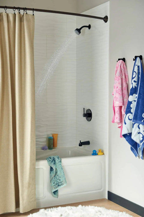 Matte black tub and shower trim kit with 6-function shower head spraying water in a bathroom; includes reliable valve trim upgrade.