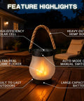 Solar Lantern Outdoor Lights With Realistic Dancing Flame Effect for Camping and Patio Use, shown on a wooden table at night