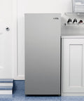 7 Cu Ft Upright Convertible Refrigerator And Freezer With Manual Defrost And Garage Ready Build In Brushed Stainless Steel in kitchen setting.