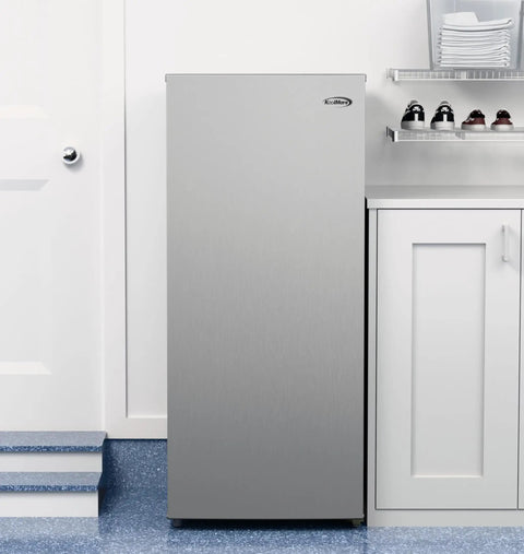 7 Cu Ft Upright Convertible Refrigerator And Freezer With Manual Defrost And Garage Ready Build In Brushed Stainless Steel in kitchen setting.