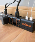 Rotating Surge Protector Power Strip With Six Swivel Outlets And Two USB Ports, 1080 Joules Of Surge Protection on wood floor