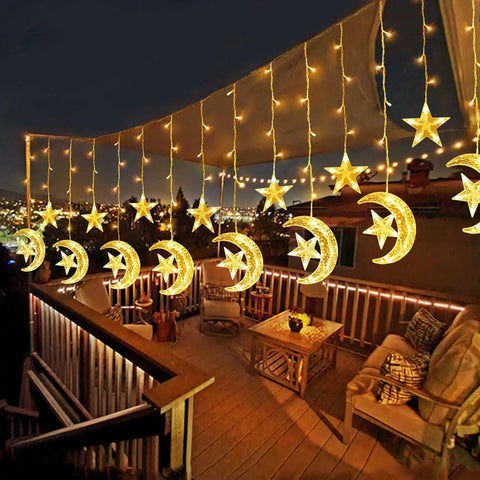 Solar String Lights Outdoor for Ramadan Eid Decor, 138 LED Star Moon Curtain Lights on backyard patio at night