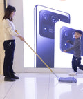 Heavy Duty Commercial Mop Set With Fifty Eight Inch Handle And Three Machine Washable Cotton Loop Heads being used on a clean floor.