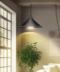 Knockout Black Plug In Pendant Light With Adjustable 13 Ft Copper Cord And UL Certified E26 Socket, illuminating a cozy room.