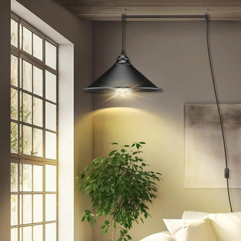 Knockout Black Plug In Pendant Light With Adjustable 13 Ft Copper Cord And UL Certified E26 Socket, illuminating a cozy room.
