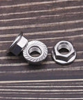 10-24 UNC Serrated Flange Hex Lock Nuts In Durable 304 Stainless Steel That Fights Vibration And Loosening, three nuts on surface