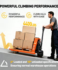 Heavy Duty Electric Pallet Jack With 4400 Lb Capacity And Lithium Battery moving boxes up an incline with operator guiding.