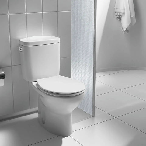 Bathroom scene with a toilet tank featuring a Side Mount Toilet Flush Lever Handle Replacement For Most Toilet Tanks Universal Zinc Alloy Lever with Silver And Gold Finish Dope Upgrade For A Cleaner Modern Look.