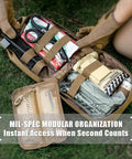 Open Rhino Rescue IFAK trauma kit in tan MOLLE pouch showing tourniquet, scissors, dressings on grass