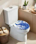 Elongated Chinoiserie Blue Peacock Floral Design Traditional Toilet Seat on a modern toilet in a stylish bathroom.