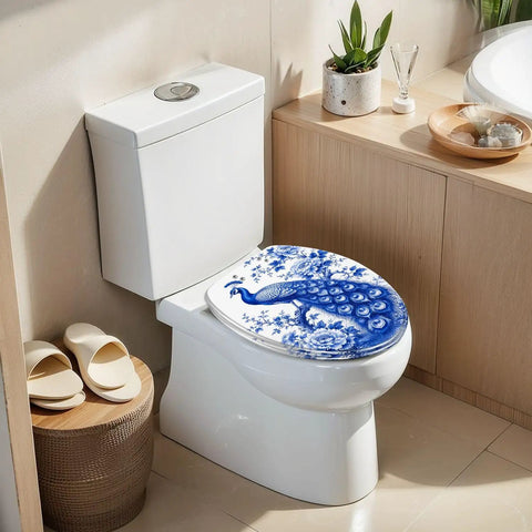 Elongated Chinoiserie Blue Peacock Floral Design Traditional Toilet Seat on a modern toilet in a stylish bathroom.