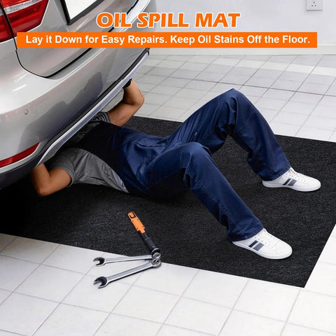 Man working under car on oil spill mat for driveway and garage floor 36x60 heavy duty protector with anti leak backing