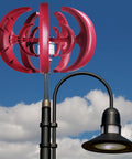 4500W Vertical Axis Wind Turbine Kit for Home Power, 12V System, five red blades installed beside a streetlight, cloudy sky background