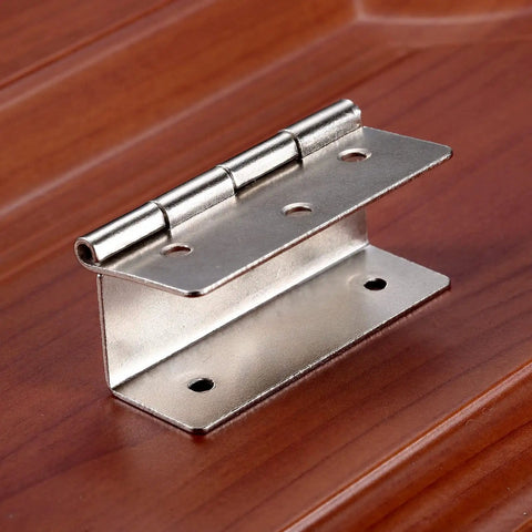 Close-up of a 59mm silver cabinet door hinge for furniture, showing six-hole tri-fold design on wooden surface.