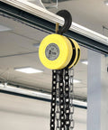4400 Lb Capacity Chain Hoist With 2 Ton Manual Hand Chain Block hanging in workshop, G80 chain, alloy steel, 360 degree hook, yellow