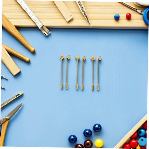 Awesome 50 Sets Copper Flat Round Blank Base Brooch Pins With Secure Safety Backs Perfect For DIY Jewelry Making Scarf Badges And Easy Electroplating Crafts That Will Supercharge Your Creative Projects Without The Scratches. Flat round copper brooch pins displayed in a creative workspace.