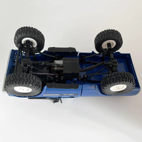 Underside view of RC Crawler C24 4x4 Off Road Truck RTR 1/16 Scale All Terrain With Proportional Steering 2.4GHz Radio LED Lights