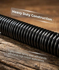 Close-up of heavy-duty coiled spring steel, part of Electric Wrench Sleeve Universal Extension Rod With Flexible Shaft And 360 Degree Flex Reach For Tight Spaces Automotive And DIY Projects Socket Locking System Keeps Sockets Secure, on wood.