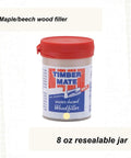 8 oz jar of Maple Beech Pine Hardwood Wood Filler showing label and red lid for DIY interior repairs