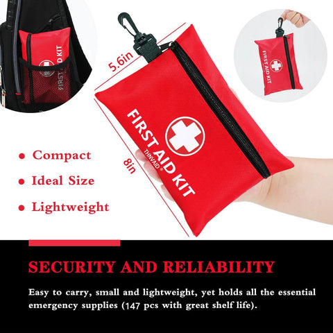 Red compact nylon mini first aid kit with zipper and carabiner clip, white cross, 147-piece set for travel.