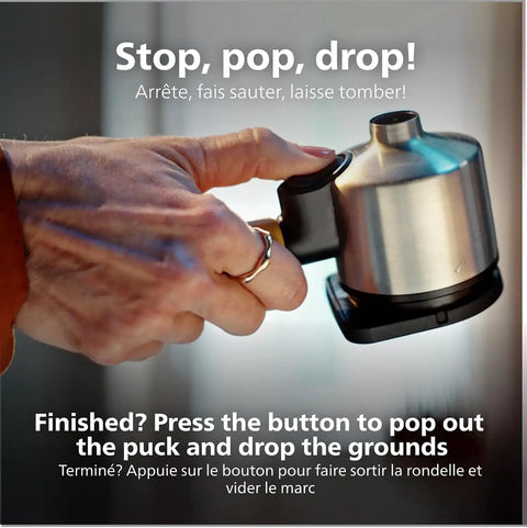 Hand holding Compact Home Espresso Machine With Built In Grinder And 16 Bar Pump Auto Grinding Tamping And Brewing For Smooth Bean To Cup Coffee Without The Daily Grind Stress.