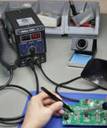 Technician using 2 In 1 Hot Air Rework And Soldering Iron Station For Pros with 10 solder iron tips, 4 nozzles on circuit board