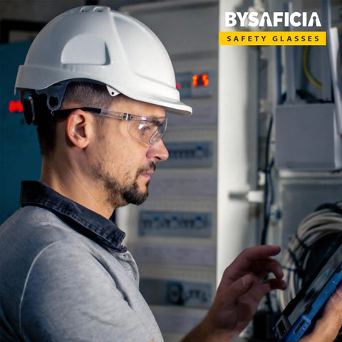 Person wearing 12 Pack Clear Safety Glasses Bulk With Kickass Scratch Resistant Polycarbonate Lenses And Sweet Uv Protection For Heavy Duty Job Sites And Weekend Diy Projects Rock Solid Ansi Z87 Approved while using a tablet.