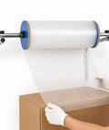 No Sweat Wall Mounted Foam Wrap Dispenser With Smooth Rolling Galvanized Steel Bubble Cushion Holder in use, dispensing bubble wrap.