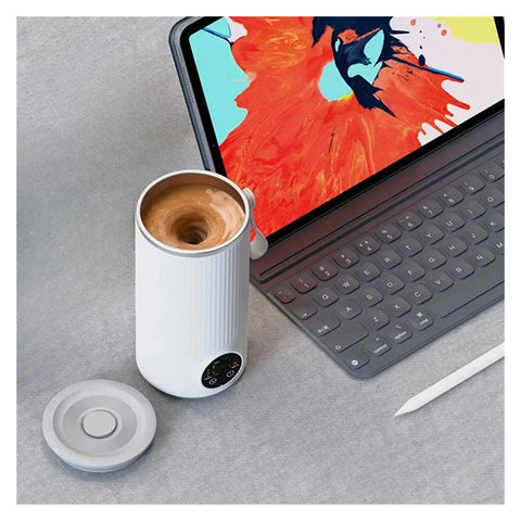 Grab And Go Heated Self Stirring Mug Electric Magnetic Mixing Travel Cup Rechargeable Stainless Steel Coffee And Tea Warmer on desk.