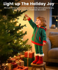 Child in festive outfit decorating a Christmas tree with Clear Christmas String Lights 100 Count On Green Wire 20 Feet Incandescent Mini Bulbs