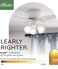 Ceiling-mounted 42 Inch Newsome Premier Bronze Low Profile Ceiling Fan With LED Light Kit, shown in a bright room.