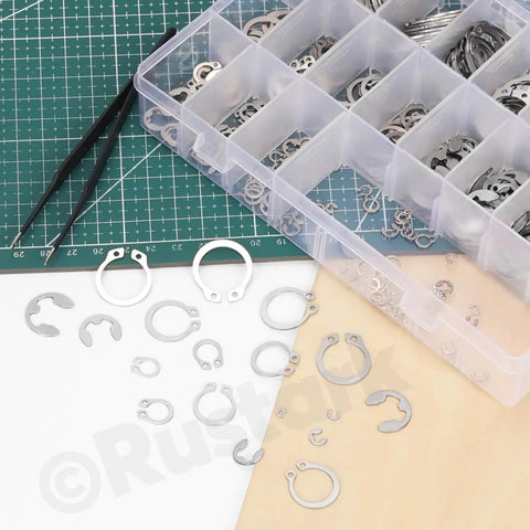 304 Stainless Steel E Clip And C Clip Retaining Rings Kit With Tweezers, 303 Pcs Assortment, 21 Sizes From M1.5 To M28 displayed on table
