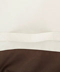 Detail of Three Seater Outdoor Sofa Cover Weatherproof Protector For Patio Furniture with beige and tan fabric close-up