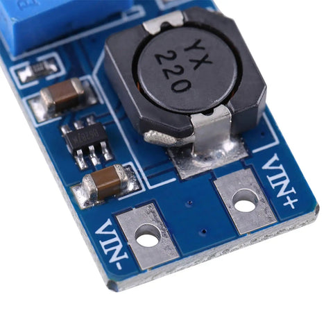 DC To DC Boost Converter Module With Adjustable Output 2V To 28V, 2 Amp High Efficiency Power Supply For Battery Projects And DIY Gadgets, Solar And Camping Gear, Tiny 36 By 17 By 14 Mm. Close-up blue circuit board with 220 inductor, VIN pads