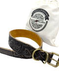 Heavy Leather Dog Collar Featuring Hand Carved Celtic Chain Design And Plush Suede Backing on display with brass hardware.