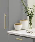 7 Inch Center To Center Golden Champagne Cabinet Pulls Set Of 10, Nine And Three Eighths Inch Overall Length, visible on cabinet