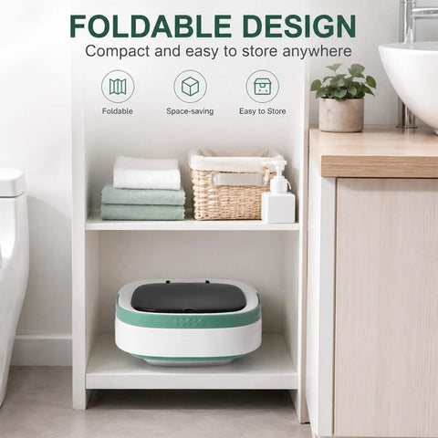 Compact Portable Foldable Washer With Amped Up Motor And Three Wash Cycles on shelf with towels and plants.
