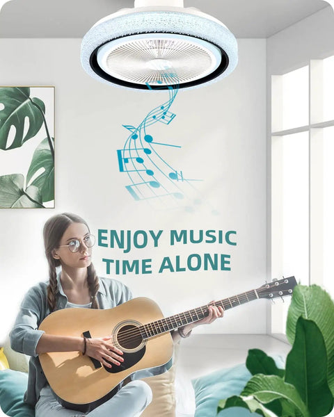 Woman playing guitar under bladeless flush mount ceiling fan with lights and Bluetooth speaker, promoting music enjoyment.